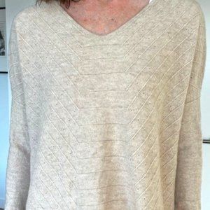 Black Goat Cashmere long-sleeve sweater, texture. Size S, colour Sand